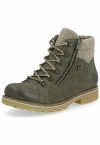Botas de tobillo verde oliva hechas de cuero con un cuello de fieltro, que cuentan con una cremallera lateral, puntera redonda y una suela ligera marrón clara con profundas estrías.