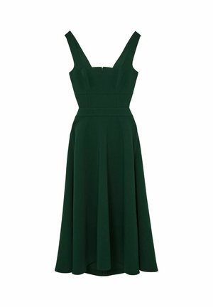 Mørkegrøn A-formet kjole med en tætsiddende overdel, brede stropper og en udvidet nederdel. Den har en diskret tekstur og en lynlås bagpå.