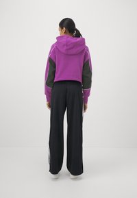 Nike Sportswear PANT - Tracksuit bottoms - black/white