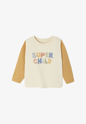 Long-sleeve shirt with cream body, mustard sleeves. "SUPER CHILD" printed in colorful, textured letters. Features snap closures at the neckline.