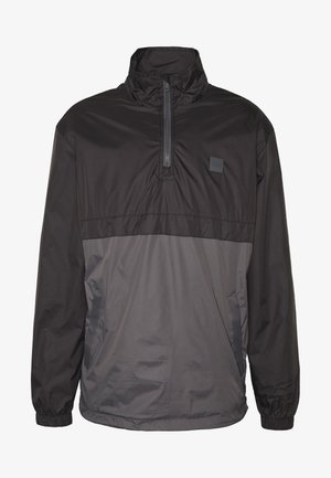 Fekete és szürke pulóverdzseki magas gallérral, félcipzárral az elején, rugalmas mandzsettákkal és oldalsó zsebekkel. Könnyű, sima anyagból készült.