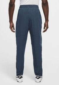 Nike Performance Pantalones deportivos - armory navy/plum dust/white