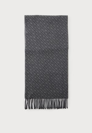 Écharpe gris foncé à motifs avec des extrémités à franges, étalée à plat sur un fond blanc.