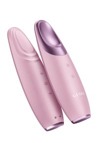 Rosa ansiktsapparat med en glänsande lila övre sektion, utrustad med knappar för temperaturkontroll och en varumärkeslogotyp. Slät, ergonomisk design.