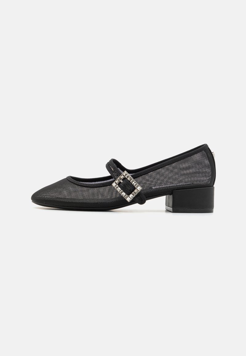 Black mesh low-heeled shoes feature a rounded toe with a decorative buckle strap. The design includes a textured finish and subtle accents.