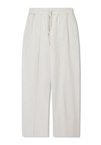 Light beige wide-leg pants made of soft fabric, featuring an elastic waistband with drawstring, two side pockets, and front pleats.