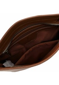 Brown leather bag with a textured exterior, featuring a zippered compartment and a smooth fabric interior with multiple pockets.