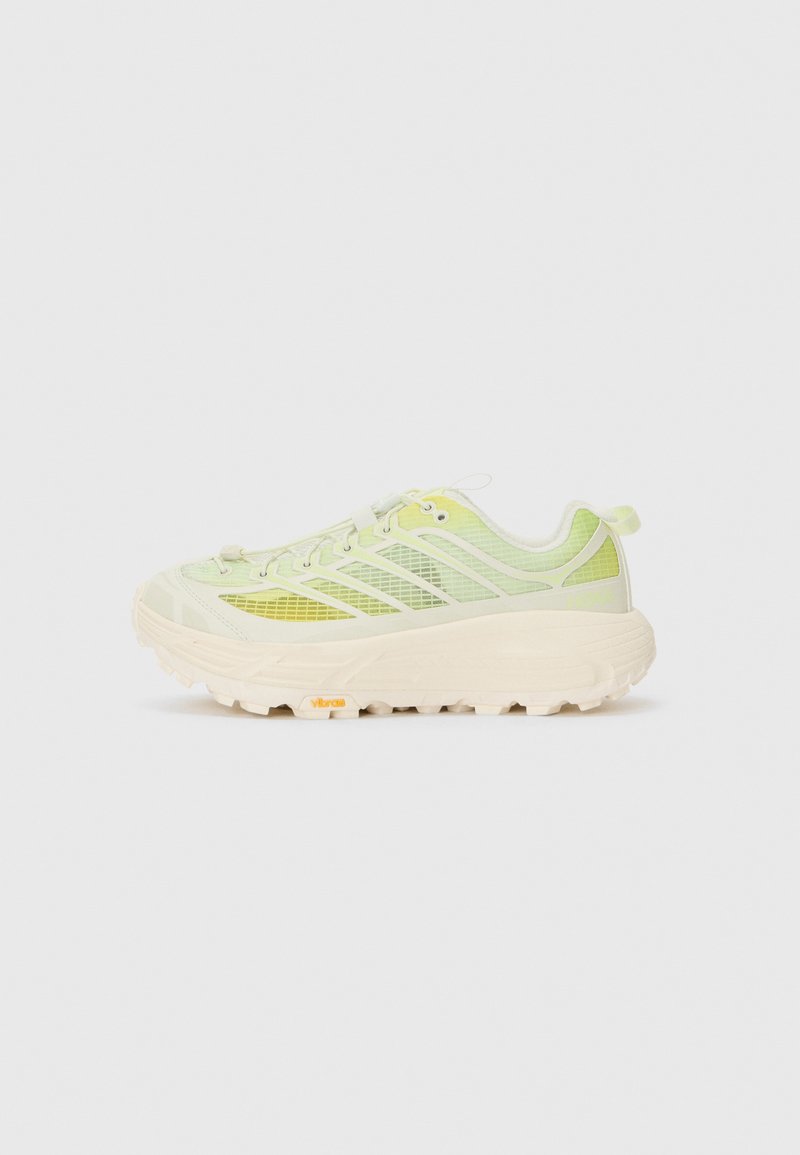 Light green sneakers with a mesh upper, thick white sole, and Vibram branding. Features a textured design with contrasting accents.