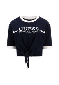 Navy crop top featuring a white ribbed neckline and sleeves, tie-front design, and "GUESS Sports Club Los Angeles" logo in white.