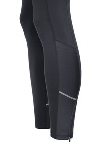 Leggings de sport noirs au design ajusté, avec des panneaux latéraux texturés, des accents réfléchissants et un ourlet inférieur de jambe zippé.
