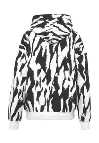 Hooded sweatshirt in black and white zebra print, featuring a kangaroo pocket, ribbed cuffs, and hem. The fabric appears soft and textured.