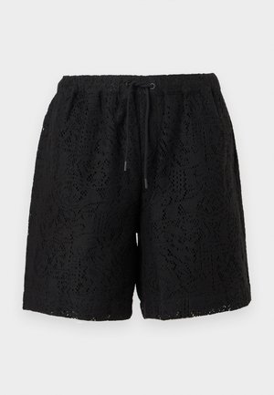 Schwarze Spitzen-Shorts mit elastischem Bund und schwarzer Kordel, durchgehend mit floraler Cutout-Musterung im Stoff.