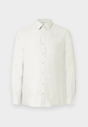 Svijetlo bež lanena košulja s kopčanjem na dugmad, dugim rukavima i klasičnim ovratnikom. Na prsima ima mali logo.
