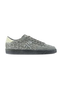 Glittery grey sneakers with a suede upper, black rubber sole, and silver skull crossbones detail on the side. Lace-up design.