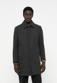 Cappotto grigio a motivo houndstooth con colletto, sei bottoni neri e tasche laterali, caratterizzato da una vestibilità dritta e una tessitura texture.