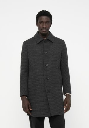 Gray houndstooth coat with a collared neck, six black buttons, and side pockets, featuring a straight cut and textured weave.