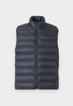 Temno modra prešitna brezrokavnik s povišanim ovratnikom in sprednjim zadrgo, predstavljen na svetlo sivi podlagi.