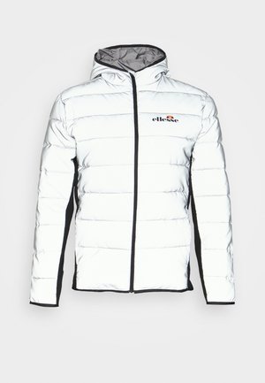 Veste matelassée blanche avec capuche, fermeture éclair noire et panneaux latéraux noirs, arborant le logo Ellesse sur la poitrine.