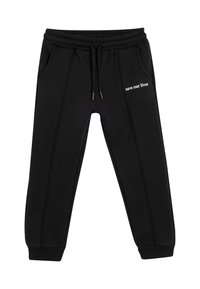 Sorte sweatpants med snørremidje, to sidelommer og hvid tekst "red vores liv" på venstre ben. Glat stof og ribbede manchetter.
