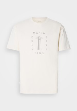 Cream cotton t-shirt featuring a light grey lighthouse graphic with "MAKIA," "ESTD 2001," and "TTRS" text. Short sleeves, round neckline.