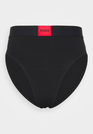 Black high-waisted briefs made of stretch material, featuring a solid texture and a prominent red logo label on the waistband.
