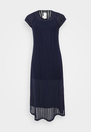 Navy knit dress with short sleeves, V-neck, and a textured pattern. Features a longer back hem with a scalloped edge.