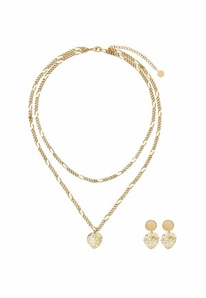 Double-layered gold chain necklace and matching gold leaf-shaped earrings on white background.