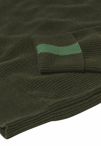 Knitted dark green sweater featuring a textured ribbed pattern and a contrasting green accent on the cuff.