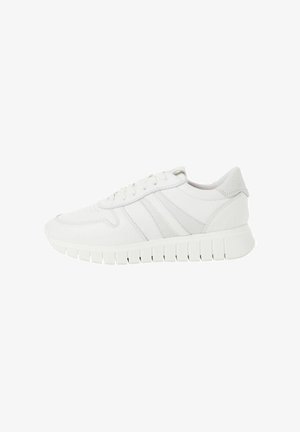 White athletic shoes with a smooth leather upper, three horizontal grey stripes, and a textured rubber sole featuring ridges for grip.