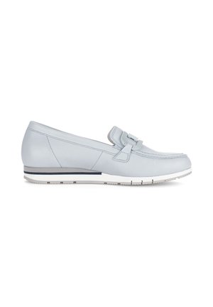 Light grey leather loafer with low heel, decorative strap, and white rubber sole with grip tread, shown from the side.