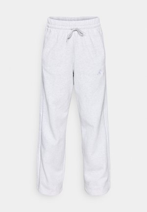 Szare spodnie dresowe z elastycznym pasem, sznurkiem oraz bocznymi paskami. Tekstura tkaniny wydaje się miękka i pluszowa.