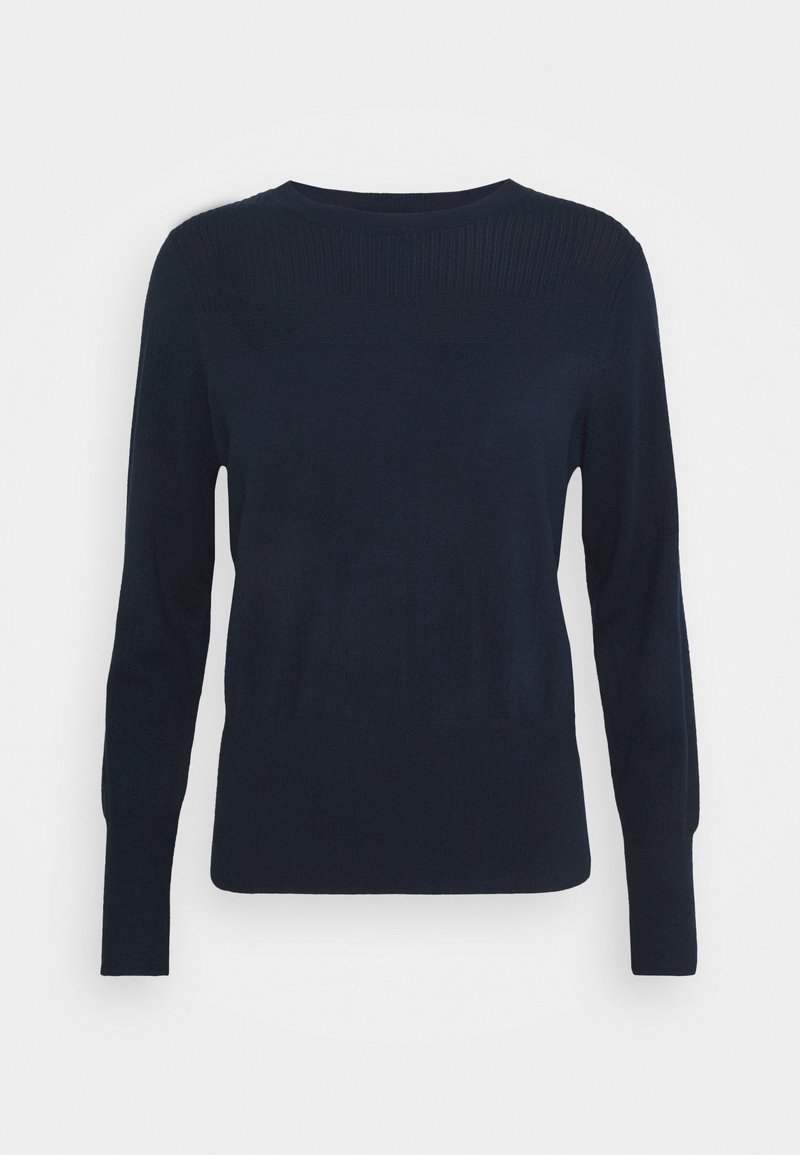 Pull bleu marine à manches longues et col rond. Motif texturé sur la partie supérieure. Tissu lisse, silhouette ajustée.