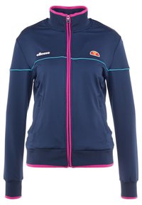 Marinblå jacka med dragkedja och rosa samt turkosa detaljer, tillverkad av mjukt tyg. Har hög krage och sidofickor. Logotyp på bröstet.