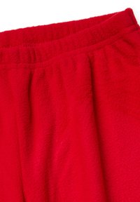 Rode fleecebroek met een elastische tailleband, voorzien van een zachte textuur en een gladde afwerking. Close-up geeft de dikte van de stof weer.