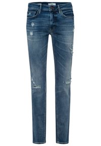 Jeans de mezclilla azul con un ajuste slim, que presentan detalles desgastados y decoloración, cinco bolsillos y un cierre de botón en la cintura.