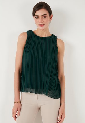 Green pleated sleeveless top with a round neckline and flowing hemline, made of lightweight fabric, showcasing vertical pleats and sheer texture.