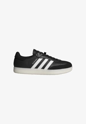 Black leather sneaker with three white stripes, perforated upper, lace-up closure, and white rubber sole with textured tread pattern.