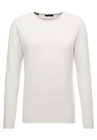 Světlý béžový svetr s dlouhými rukávy, texturovaným vzorovaným úpletem, kulatým výstřihem a rovnou spodní linií. Bez viditelné kovové dekorace nebo doplňků.