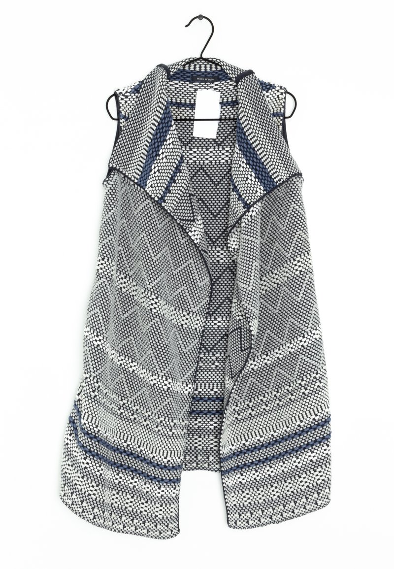 Cardigan senza maniche, motivo intrecciato in bianco e nero con accenti blu. Tessuto leggero, scollo drappeggiato e design aperto.