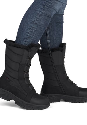 Black winter boots with a padded upper, faux fur trim, lacing, and side zipper. Textured rubber sole for traction on various surfaces.