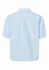 Light blue short-sleeve shirt with a collared neckline, puffed sleeves, back pleat detail, and a loose fit. Cotton material.
