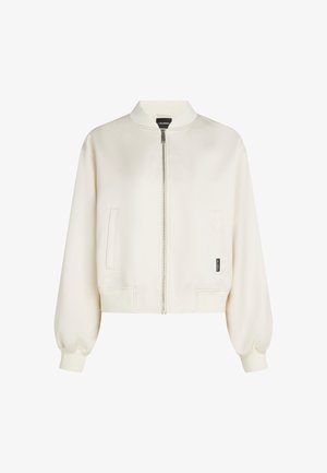 Krém színű rövidített bombázó dzseki, elöl cipzáros, bordázott mandzsetta és szegély, két oldalsó zsebbel, sima textúrával és klasszikus gallérral.