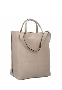 Beżowa skórzana torba typu tote z dwoma uchwytami, z kieszenią naszywaną z przodu i kontrastowym czarnym wykończeniem wzdłuż krawędzi.