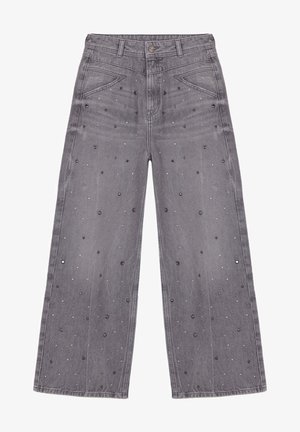 Szare jeansy o szerokich nogawkach z dekoracyjnymi małymi czarnymi i srebrnymi ćwiekami rozsianymi na przednich panelach i kieszeniach, z szlufkami na pasek i zapięciem na guziki.