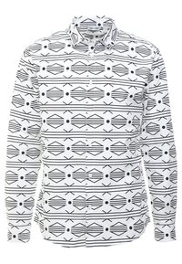 Camicia bianca a maniche lunghe con un motivo geometrico nero di diamanti, linee e cerchi. Presenta una chiusura con bottoni e colletto.