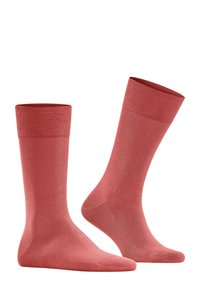 Rosa Baumwollsocken mit einem gerippten Bündchen, ausgestattet mit einer glatten Textur und einer nahtlosen Zehenpartie für Komfort und eine formschlüssige Passform.