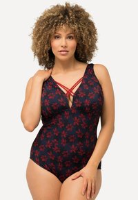 Maillot de bain une pièce bleu marine avec un motif floral rouge. Il présente un décolleté en V profond et des bretelles croisées. Fabriqué en tissu lisse et extensible.