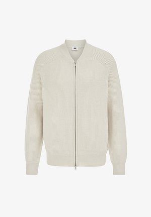 Lichtbeige vest met ritssluiting gemaakt van geribbelde stof met raglanmouwen en een gebandeerde kraag, voorzien van een zilveren rits en zonder extra accenten.