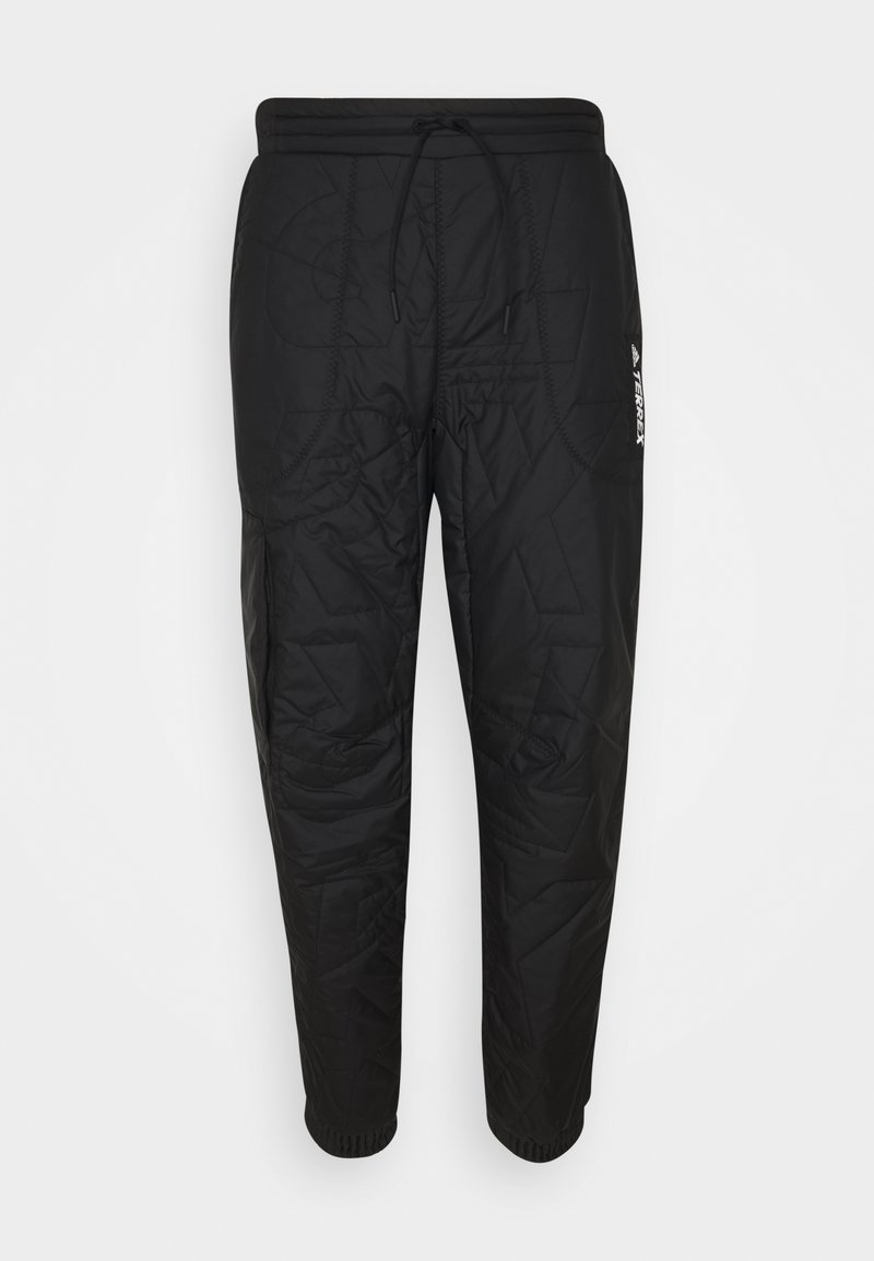 Svarta kviltade byxor med dragsko i midjan, elastiska ärmslut och detaljmönster. Har en liten vit logotyp på sidan.
