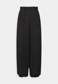 Pantalon large noir avec taille élastique et ourlet à la cheville sur fond uni.